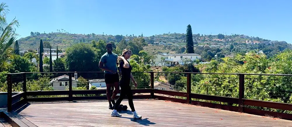 Del Cerro Park in Mission Valley _ 30 year old male client watches female personal trainer instruct tricep extension 4